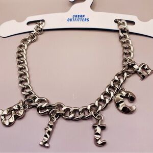 Urban Outfitters silver tone textured letter B**tch letter charm pendant choker